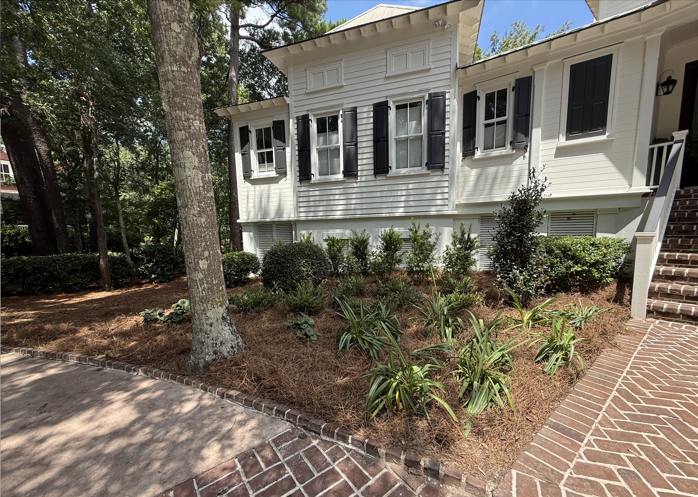 Pine needles and the flower bed need regular maintenance.